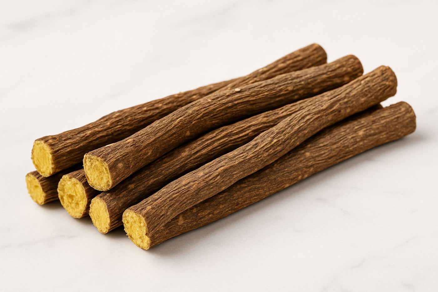 Licorice sticks on white table