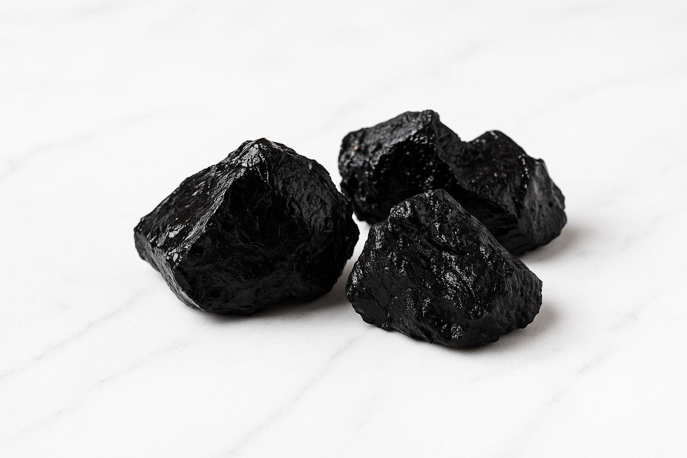 shilajit chuncks on white marble table